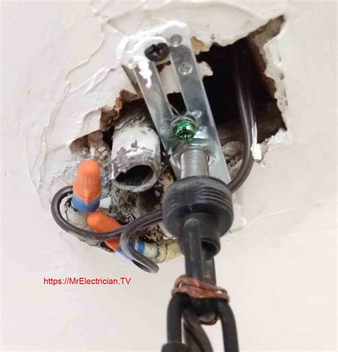 how to remove plastic electrical box from ceiling|removing an old ceiling fan.